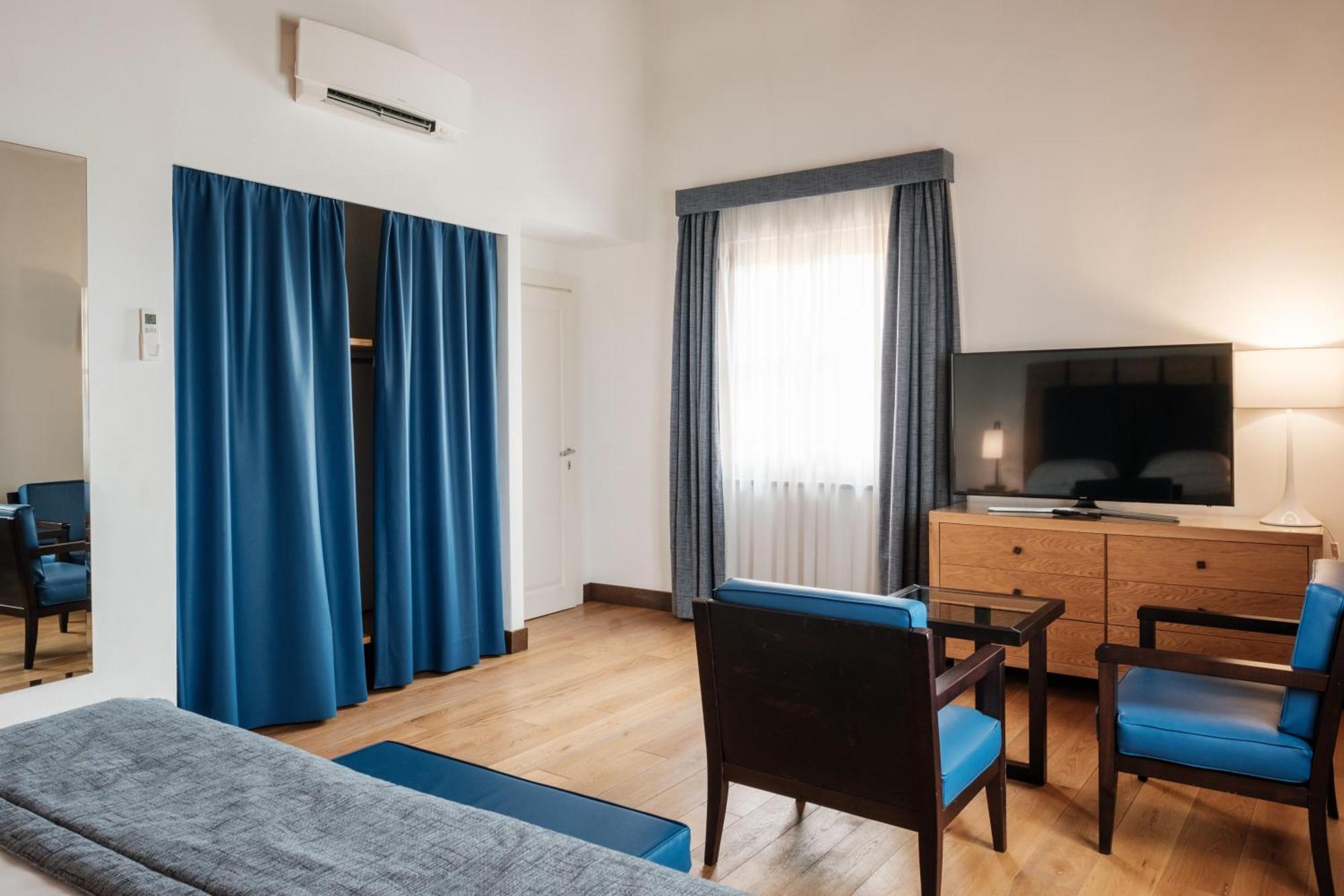 Villa Tolomei Hotel & Resort Florens Exteriör bild A room at the hotel
