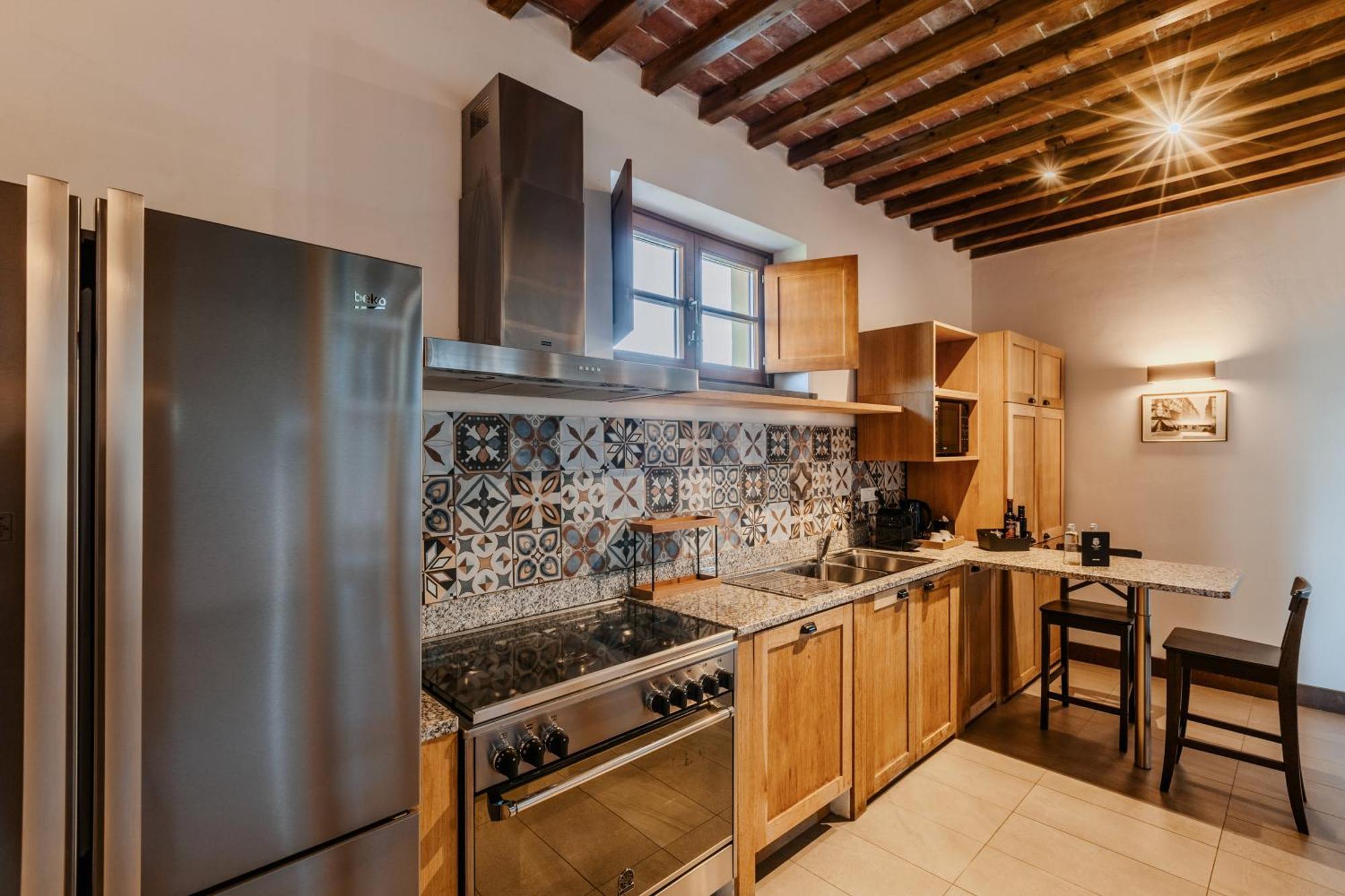 Villa Tolomei Hotel & Resort Florens Exteriör bild Kitchen