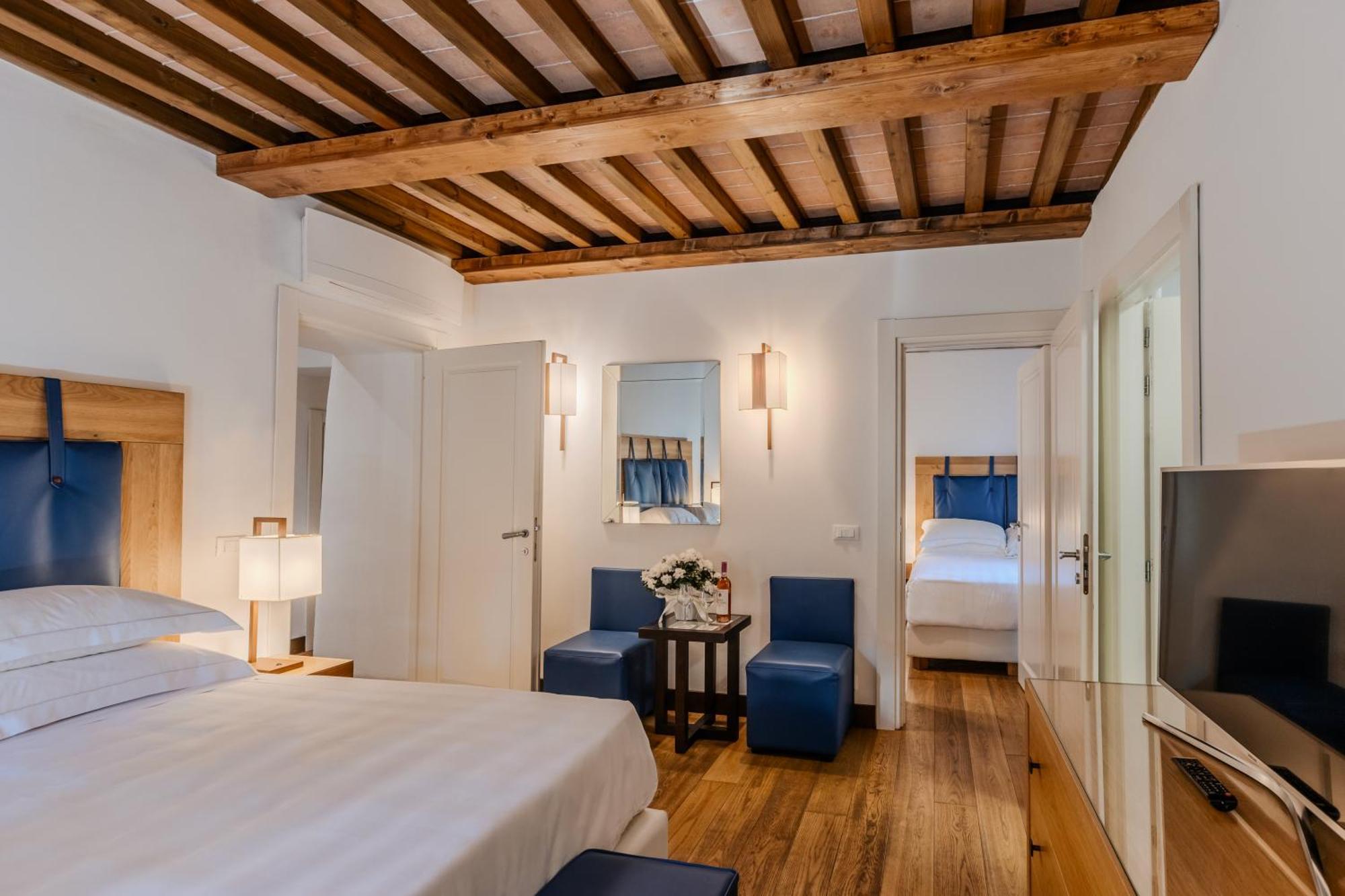 Villa Tolomei Hotel & Resort Florens Exteriör bild Family room